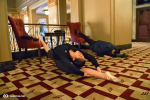 Dancers Angelina Liu (left) and Chelsea Cai make stretching look like they are sleeping. Literally. (photo by Annie Li)
