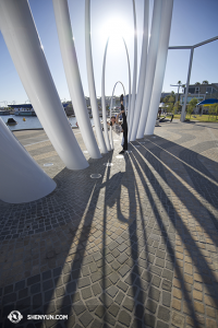 Meanwhile, in Australia’s Perth… dancer Fadu Chen echoes the shapes of shadows by the harbor. (photo by dancer Stephanie Guo)
