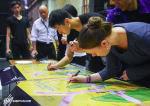 Before leaving Melbourne, performers signed two posters as souvenirs.  (photo by dancer Ben Chen)
